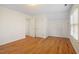 Large bedroom with multiple doors and windows offering plenty of natural light at 1120 Colonial Club Rd, Wake Forest, NC 27587