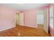 Bedroom with hardwood floors, two closets, and a door leading to another room at 1120 Colonial Club Rd, Wake Forest, NC 27587