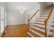 Elegant entryway featuring hardwood floors, a chandelier, and staircase at 1120 Colonial Club Rd, Wake Forest, NC 27587