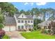 Charming two-story home with a manicured lawn and a two-car garage at 1120 Colonial Club Rd, Wake Forest, NC 27587
