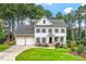 Charming two-story home with a manicured lawn and a two-car garage at 1120 Colonial Club Rd, Wake Forest, NC 27587