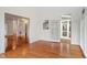Spacious living area with hardwood floors, recessed lighting, and multiple access points to other areas of the home at 1120 Colonial Club Rd, Wake Forest, NC 27587