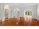 Spacious living room featuring hardwood floors, bright windows, and an open floor plan at 1120 Colonial Club Rd, Wake Forest, NC 27587