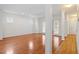 Spacious living room featuring hardwood floors, large windows, and crown molding at 1120 Colonial Club Rd, Wake Forest, NC 27587