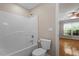 Bathroom features a toilet, shower with white walls, and a view to the bedroom at 1153 Litchborough Way, Wake Forest, NC 27587