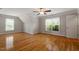 Spacious bedroom boasts hardwood flooring, natural light, and two windows at 1153 Litchborough Way, Wake Forest, NC 27587