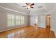 Spacious main bedroom with hardwood floors and walk-in closet at 1153 Litchborough Way, Wake Forest, NC 27587