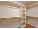 Walk-in closet with built-in shelving at 1153 Litchborough Way, Wake Forest, NC 27587
