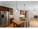 Spacious kitchen with stainless steel appliances, granite countertops, and hardwood floors at 1153 Litchborough Way, Wake Forest, NC 27587