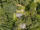Expansive aerial view of a charming home nestled in a lush green forest and landscape at 116 Justice St, Chapel Hill, NC 27516