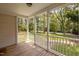 Back porch with natural light and stairs leading down to the backyard at 116 Justice St, Chapel Hill, NC 27516