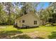 Exterior view of backyard with green grass and house in the background at 116 Justice St, Chapel Hill, NC 27516