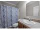 Bathroom features a marble design shower curtain, toilet, vanity, and mirror at 116 Justice St, Chapel Hill, NC 27516
