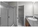 Bright bathroom with a glass shower, vanity with sink, and tile flooring at 116 Justice St, Chapel Hill, NC 27516