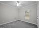 Bedroom featuring neutral walls, a ceiling fan, carpet, and a window at 116 Justice St, Chapel Hill, NC 27516