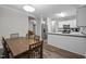 Dining area blends into a bright kitchen, boasting stainless steel appliances and ample counter space at 116 Justice St, Chapel Hill, NC 27516