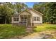 Charming single-Gathering home featuring a welcoming front porch, well-maintained lawn, and classic siding at 116 Justice St, Chapel Hill, NC 27516