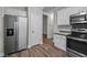 Kitchen with stainless steel appliances and white cabinets at 116 Justice St, Chapel Hill, NC 27516