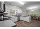 Open kitchen with stainless appliances, wood floors and breakfast nook at 116 Justice St, Chapel Hill, NC 27516