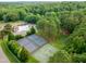 Aerial view of community amenities: pool, tennis and basketball courts, and playground at 11619 Appaloosa W Run, Raleigh, NC 27613