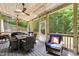 Inviting back porch with comfortable seating and ceiling fans provides a relaxing outdoor experience at 11619 Appaloosa W Run, Raleigh, NC 27613