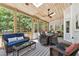 Spacious back porch featuring a ceiling fan, comfortable seating, and views of the wooded backyard at 11619 Appaloosa W Run, Raleigh, NC 27613