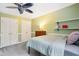 This bedroom features a ceiling fan and two closets at 11619 Appaloosa W Run, Raleigh, NC 27613