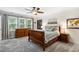 Bedroom with a ceiling fan, a wooden bed frame, and bright natural light at 11619 Appaloosa W Run, Raleigh, NC 27613