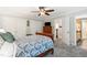 Comfortable bedroom with carpet flooring, a ceiling fan, and a view to the hallway at 11619 Appaloosa W Run, Raleigh, NC 27613