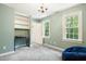 Bedroom with chandelier, built-in shelving, and a bright window offering plenty of natural light at 11619 Appaloosa W Run, Raleigh, NC 27613