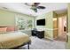 Bedroom featuring natural light, an expansive window, and a desk for a convenient workspace at 11619 Appaloosa W Run, Raleigh, NC 27613