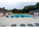 An outdoor community pool with yellow pennant flags and lounge chairs at 11619 Appaloosa W Run, Raleigh, NC 27613