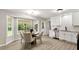 Bright dining area featuring a bay window and modern decor at 117 S Woodstone Dr, Archer Lodge, NC 27527