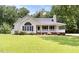 Charming single-story home with a welcoming front porch and well-maintained lawn at 117 S Woodstone Dr, Archer Lodge, NC 27527
