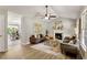 Bright living room featuring hardwood floors, a fireplace, neutral decor, and an open floor plan at 117 S Woodstone Dr, Archer Lodge, NC 27527
