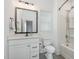This bathroom has a combination tub and shower, a mirror, modern fixtures and vanity at 1172 Cottonsprings Dr, Wendell, NC 27591