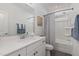 Clean bathroom featuring a white vanity, a shower-tub combo, and modern fixtures at 1172 Cottonsprings Dr, Wendell, NC 27591