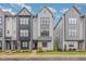 Modern gray townhome with neat landscaping and a welcoming entrance at 1172 Cottonsprings Dr, Wendell, NC 27591