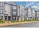 Charming townhouse with modern architectural design, well-manicured lawn, and beautiful landscaping at 1172 Cottonsprings Dr, Wendell, NC 27591