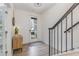 Bright foyer with stairs and natural light entering through the front door at 1172 Cottonsprings Dr, Wendell, NC 27591