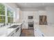 Bright kitchen featuring stainless steel appliances and white countertops at 1172 Cottonsprings Dr, Wendell, NC 27591