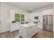 Bright kitchen featuring stainless steel appliances and a large island at 1172 Cottonsprings Dr, Wendell, NC 27591