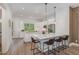 Bright kitchen featuring stainless steel appliances, a large island, and barstool seating at 1172 Cottonsprings Dr, Wendell, NC 27591