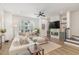 Bright living room with a comfortable sectional sofa and modern fireplace at 1172 Cottonsprings Dr, Wendell, NC 27591