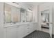 Main bathroom with double sinks, modern fixtures, and a view to the main bedroom at 1172 Cottonsprings Dr, Wendell, NC 27591