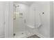 This is a modern shower with glass door, tiled walls, and a built-in bench at 1172 Cottonsprings Dr, Wendell, NC 27591