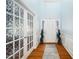 Entryway with hardwood floors, decorative french doors, and stained glass side windows at 121 Trevor Ridge Dr, Holly Springs, NC 27540