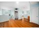 Hallway and open area with hardwood floors and a laundry room at 121 Trevor Ridge Dr, Holly Springs, NC 27540