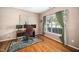Bright office space with hardwood flooring, natural light, and a functional work setup at 121 Trevor Ridge Dr, Holly Springs, NC 27540