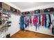 Organized walk-in closet with shelving and hanging rods, providing ample storage space at 121 Trevor Ridge Dr, Holly Springs, NC 27540